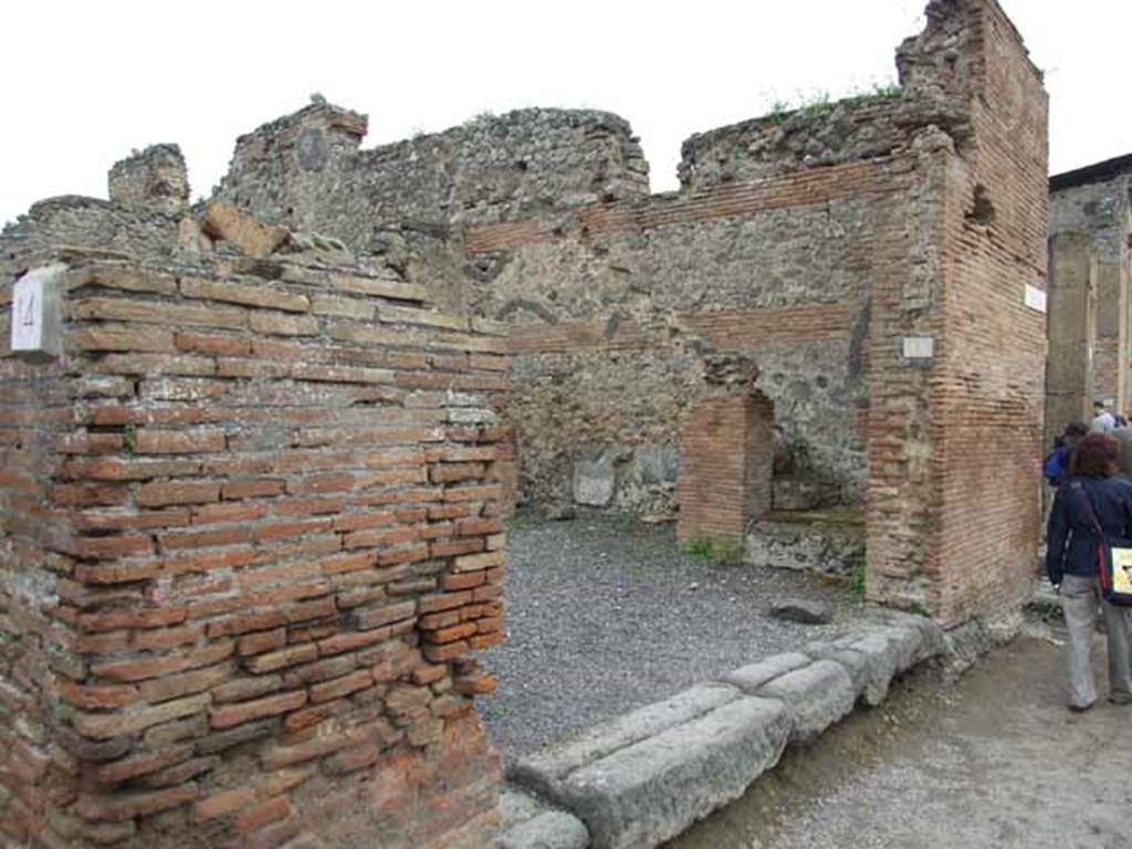 VI.10.15 Pompeii. May 2010. Looking east to shop. According to Pagano and Prisciandaro, found in April 1824 on the pilaster on the left of the entrance, was –
Priscum    [CIL IV 263]
Found in September 1829, on the pilaster on the south-east corner of the insula (on the right of the photo above) was –
C(aium) Calventium Sit[3]
IIvir(um) i(ure) d(icundo)    [CIL IV 276]
See Pagano, M. and Prisciandaro, R., 2006. Studio sulle provenienze degli oggetti rinvenuti negli scavi borbonici del regno di Napoli.  Naples : Nicola Longobardi. (p.142)  PAH II, 224; III (dated 17th March 1831), 115.

