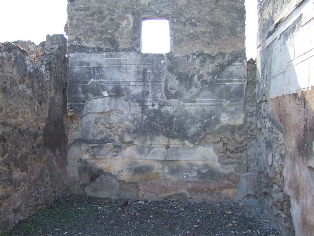VI.11.12 Pompeii. September 2005. West wall of oecus (6) with remains of 1st style decoration.