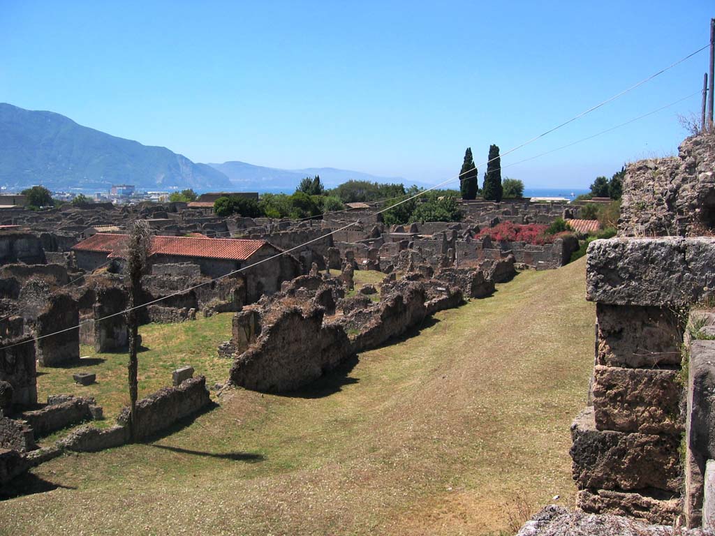 VI.11.19/20 Pompeii, on left. July 2008. 
Looking south-west from Tower X, across north end of VI.11 and VI.9 towards Sorrentine Peninsula. Photo courtesy of Barry Hobson.
