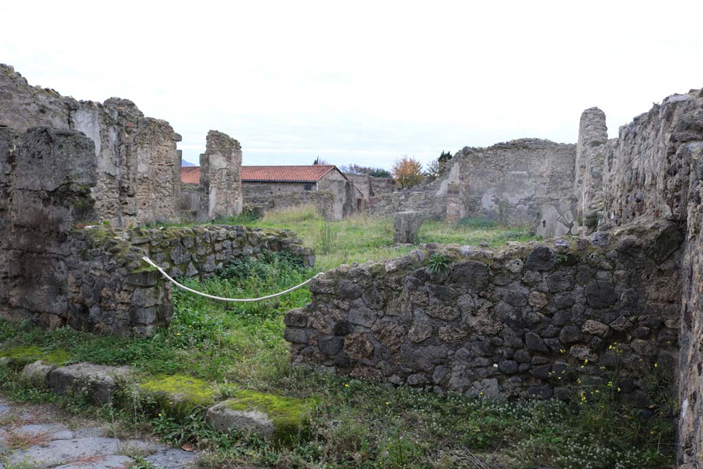 VI.11.20 Pompeii. December 2018. Looking south-west to entrance doorway, at the rear is VI.11.19. Photo courtesy of Aude Durand.