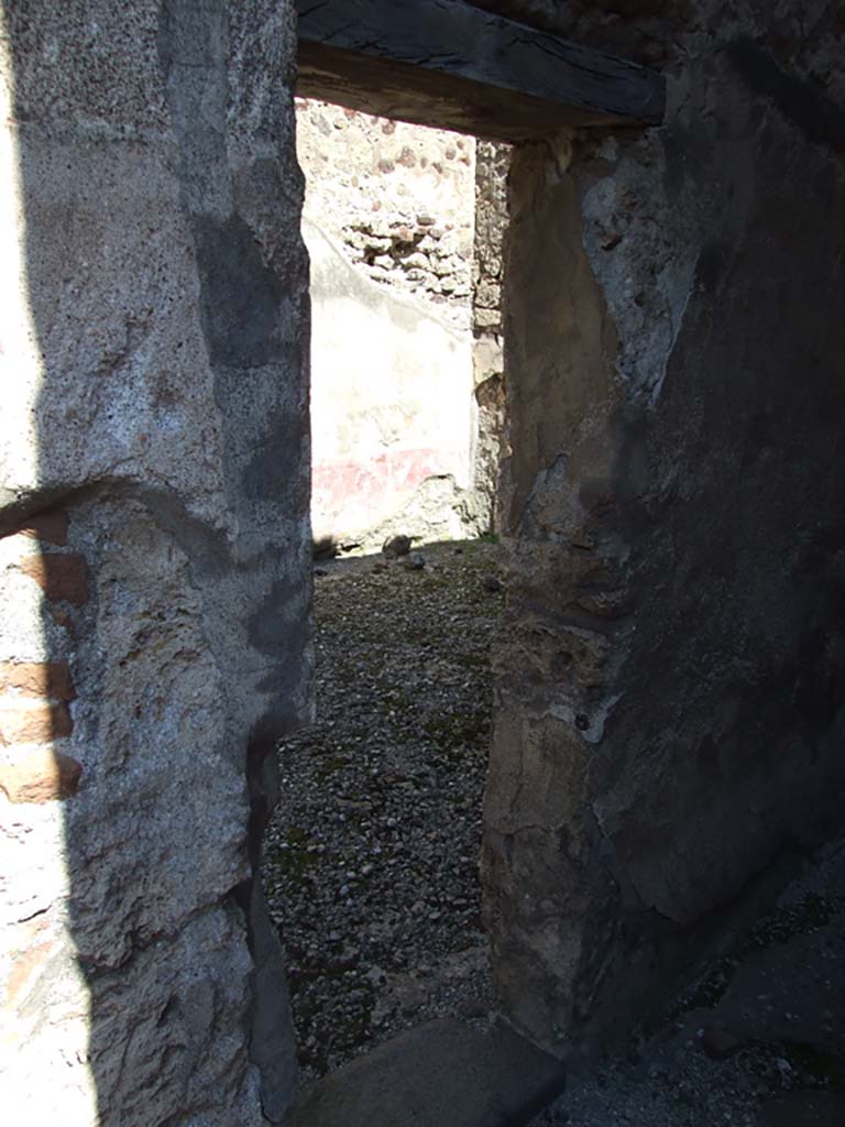 VI.14.20 Pompeii. March 2009. Room 5, north wall of corridor or andron, with small doorway into room 10.