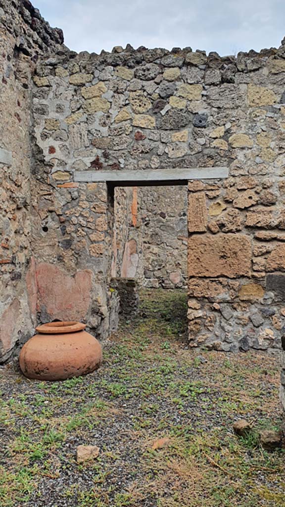 VI.14.36 Pompeii. December 2018. 
West wall of kitchen, with recess/niche above hearth in north-west corner. Photo courtesy of Aude Durand.
