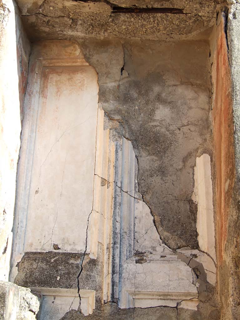 VI.14.43 Pompeii. December 2007. 
Room 6, cast of stucco door in basso-relief, showing preserved outline of a two-shutter door leading to corridor.
