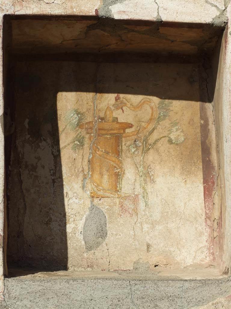 VI.14.43 Pompeii. December 2007. Niche on wall between rooms 15 and 16. According to Boyce, seven graffiti were found beneath the niche, CIL IV 1533-1539. See Boyce G. K., 1937. Corpus of the Lararia of Pompeii. Rome: MAAR 14. (p.54, no.209, with Pl.8, 2 and 3) 
According to Epigraphik-Datenbank Clauss/Slaby (See www.manfredclauss.de), these read –
Dormitu    [CIL IV 1533]
Peiosathoni feliciter    [CIL IV 1534]
Mucurd     [CIL IV 1535]    
Scribet Venus    [CIL IV 1536]
Quisquis   [CIL IV 1537]
Quidam cum peteret alas    [CIL IV 1538]
Ite Lares    [CIL IV 1539]

