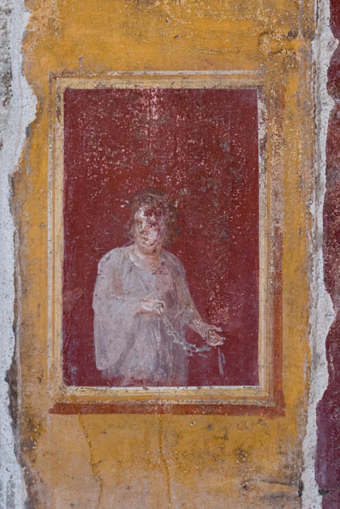 VI.15.1 Pompeii. March 2023. 
Detail from painted panel on west wall between atrium and north ala. Photo courtesy of Johannes Eber.

