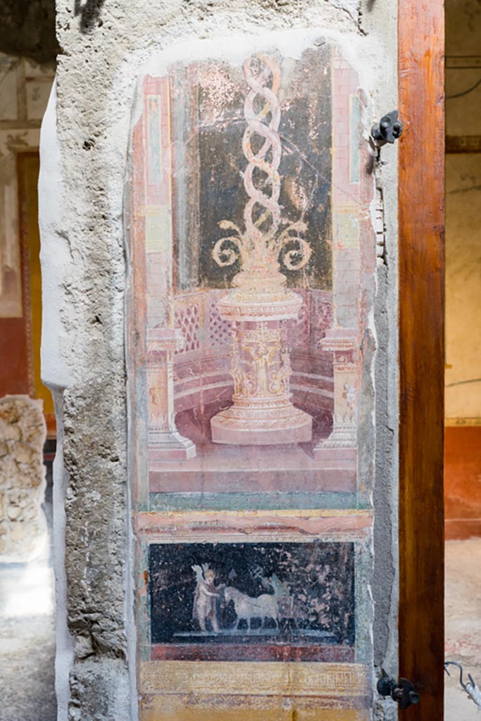 VI.15.1 Pompeii. March 2023. 
Painted panels on atrium wall between doorway to north ala, on left, and cubiculum g, on right.
Photo courtesy of Johannes Eber

