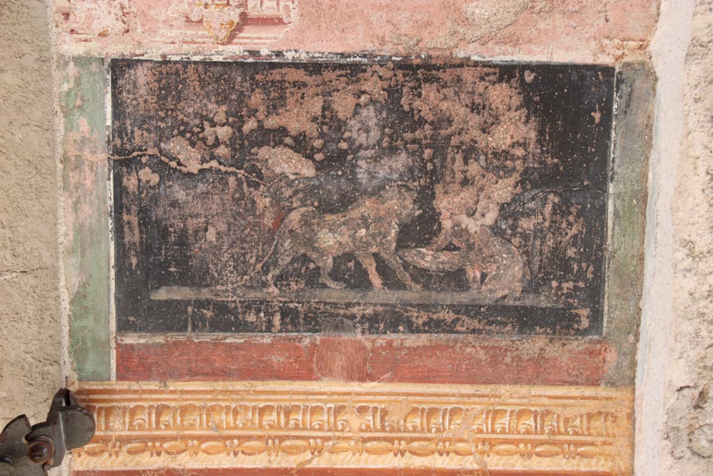 VI.15. I Pompeii. October 2023. South side of atrium, decorative painted panel between doorways. Photo courtesy of Klaus Heese.