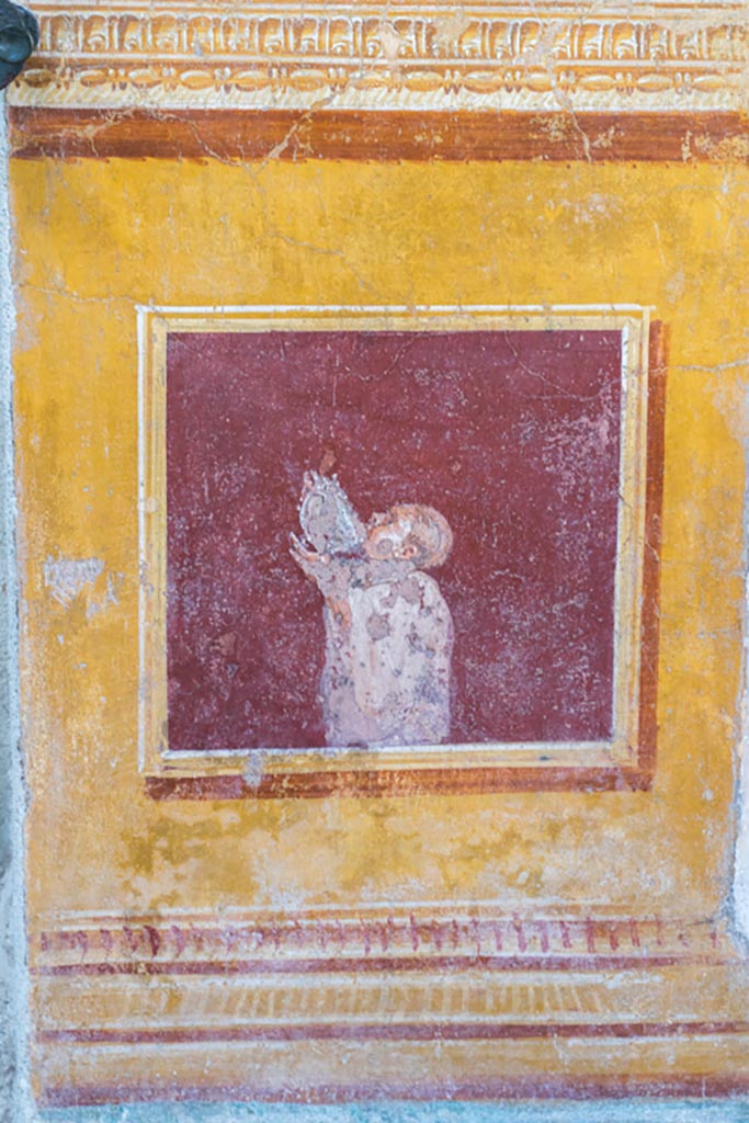 VI.15.1 Pompeii. March 2023. 
South side of atrium, decorative panel between doorways of cubiculum f, on left, and ala h, on right.
Photo courtesy of Johannes Eber.
