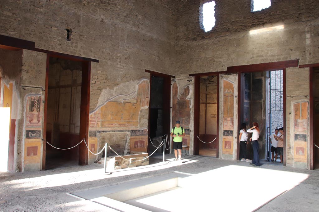 VI.15.1 Pompeii. October 2023. Looking north-east across atrium from outside south ala, h. Photo courtesy of Klaus Heese.