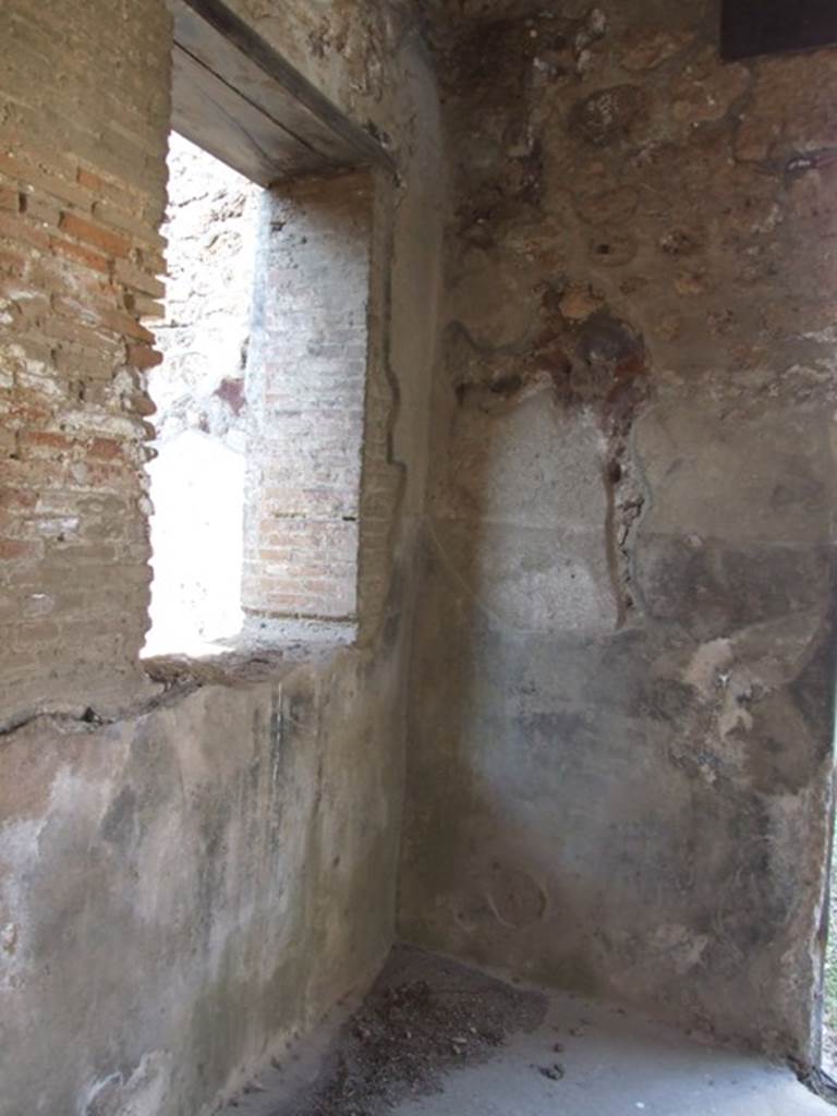 VI.15.9 Pompeii. March 2009. North-west corner of atrium, and window to triclinium.