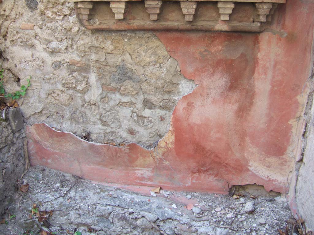 VI.15.23 Pompeii. September 2005. 
Painted west wall beneath the lararium. Part of the painted altar and some of the two serpents can still be seen.
