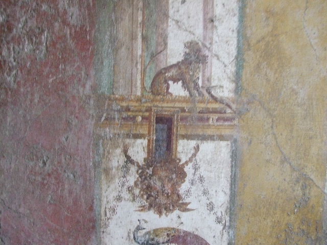 VI.16.15 Pompeii. December 2006. West wall of room F with detail of wall painting of plants.