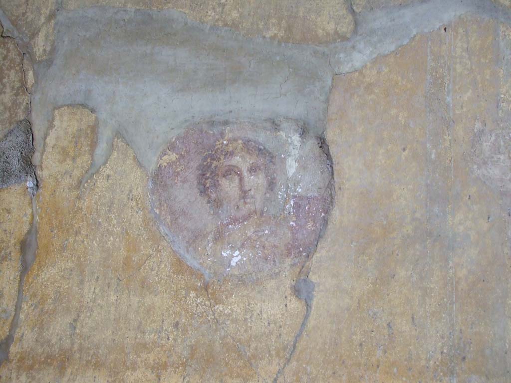 VI.16.15 Pompeii. December 2006. North end of east wall of room G with painted medallion bust.