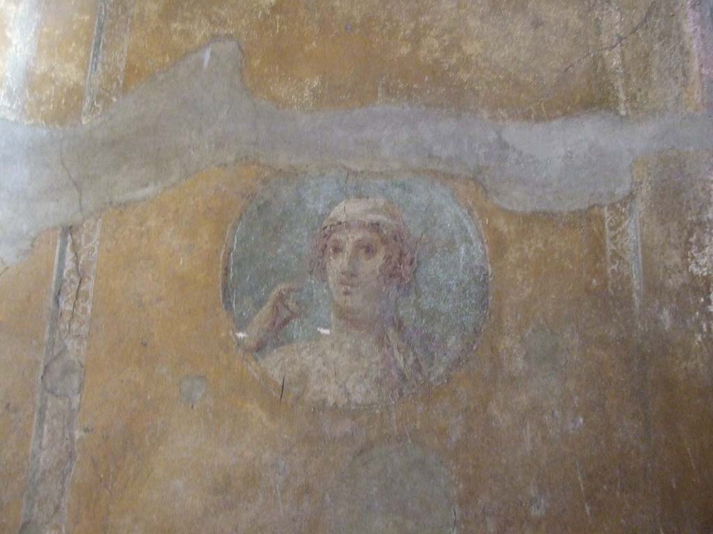 VI.16.15 Pompeii. December 2006. South end of east wall of room G with detail of painted medallion bust.