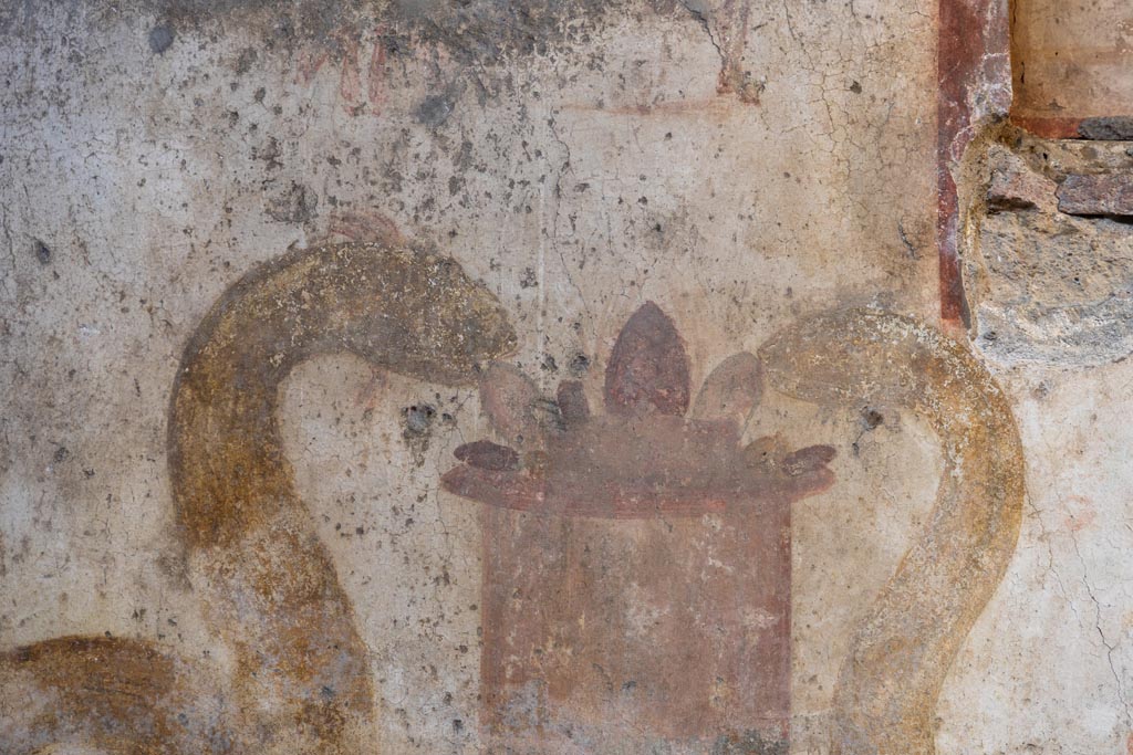 VI.16.15 Pompeii. May 2015. Detail of remains of lararium painting from niche on north wall of atrium.  Photo courtesy of Buzz Ferebee.
