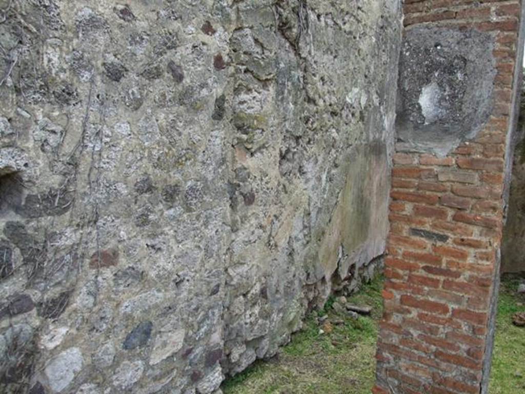 VI.16.29 Pompeii. March 2009. Stairs (a) to upper floor on south side of cubiculum C. According to NdS, at the south end of the west wall some lava stones form the start of a wooden ladder. This led to the upper floor, along the south wall of room C.