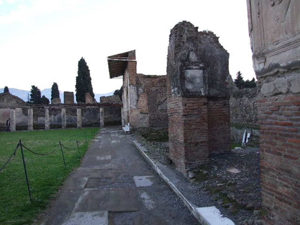 VII.1.8 Pompeii. December 2006. Looking south along the west side of gymnasium C. The west portico may have formed a bowling court as stone balls were found here.