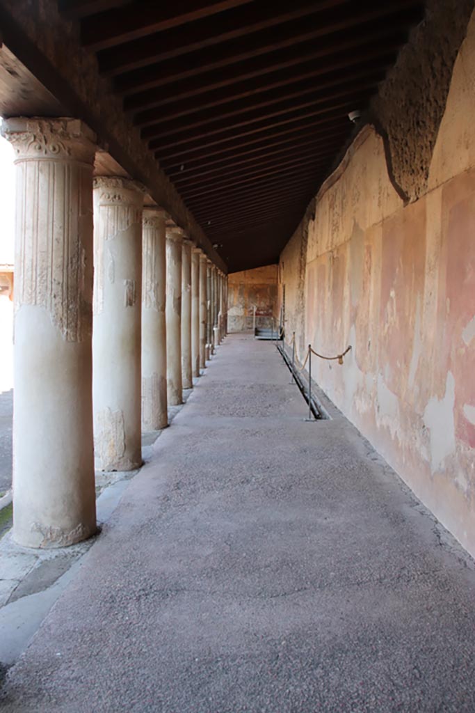 VII.1.8 Pompeii. September 2021. 
Looking north in corridor on east side of Portico B. Photo courtesy of Klaus Heese.
