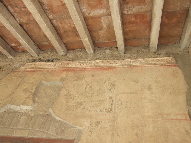 VII.1.8 Pompeii. September 2005. Detail of wall in corridor on east side of portico B.
