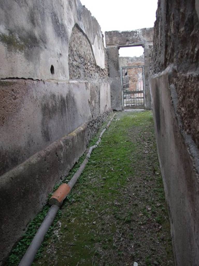 VII.1.8 Pompeii. December 2007. Women’s changing room 11. Looking east along corridor 12 to entrance at VII.1.17.
