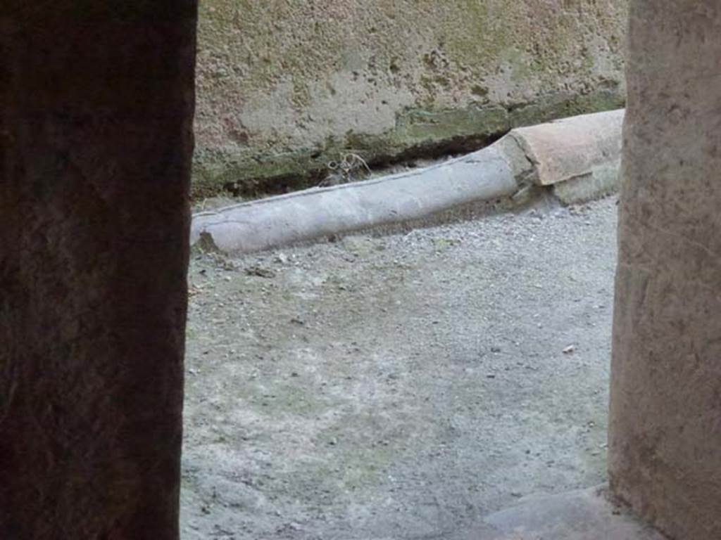 VII.1.8 Pompeii. June 2012. Lead pipe on north side of corridor 12. Photo courtesy of Michael Binns.
