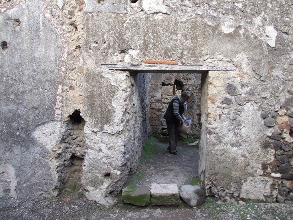VII.1.8 Pompeii. December 2007. Doorway leading to praefurnium 7 from anteroom 8. 