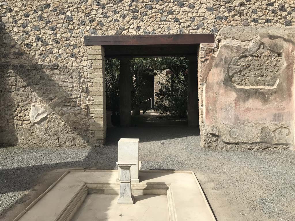 VII.1.25 Pompeii. April 2019. 
Looking west across peristyle 31 towards doorway to exedra 33, and window and doorway to triclinium 32, on right. Photo courtesy of Rick Bauer.
