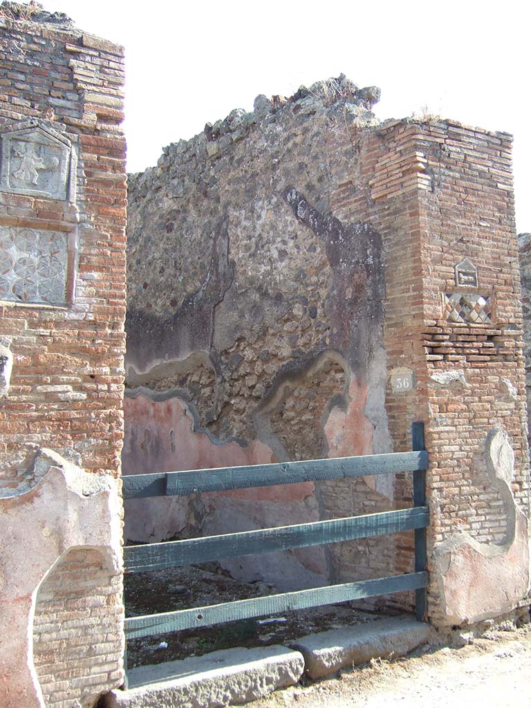 VII.1.36 Pompeii. September 2005. Entrance doorway looking towards west side, showing both plaques.