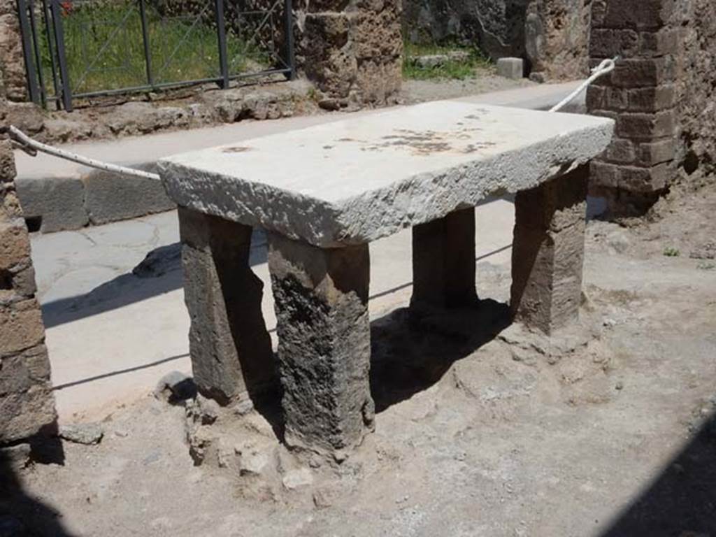 VII.1.42 Pompeii. May 2017. Looking towards table and entrance at VII.1.41. Photo courtesy of Buzz Ferebee.
