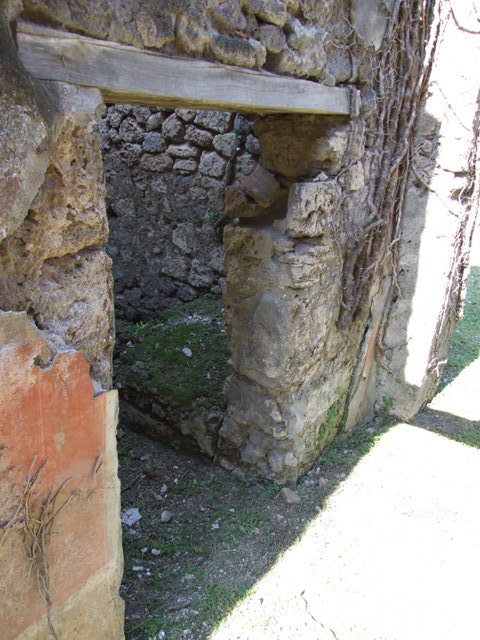 VII.2.20 Pompeii.  March 2009.  Doorway to Room 10, Small room for servants, in west wall of Corridor.
