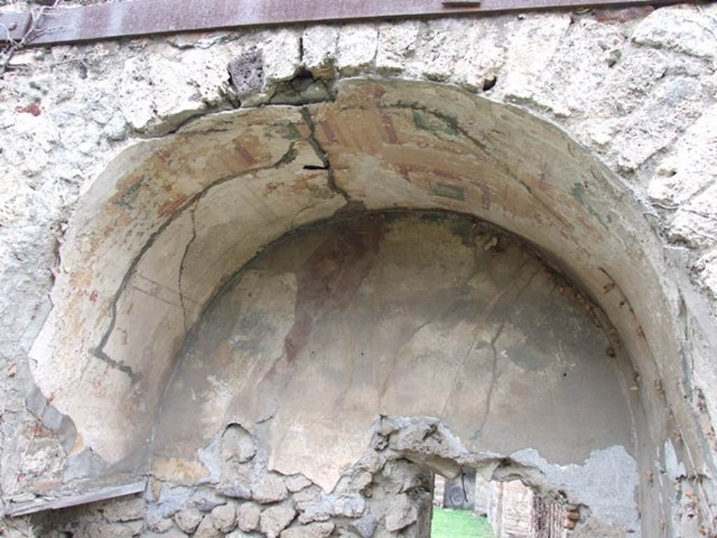 VII.2.20 Pompeii. March 2009. Painted plaster on arch in recess in north end of east wall.