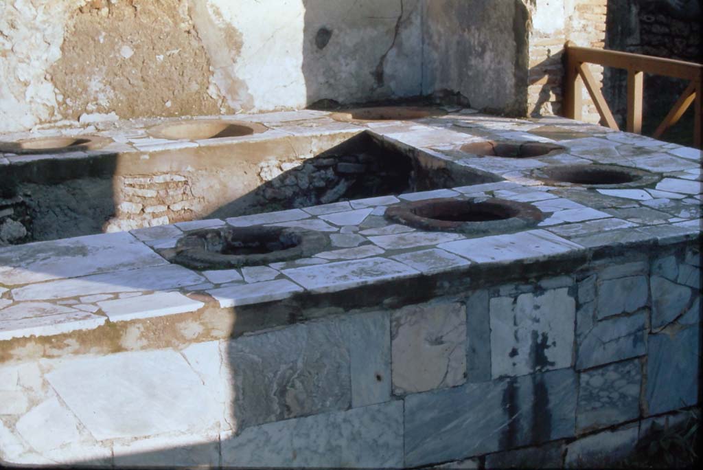 VII.2.32 Pompeii. 4th December 1971. Looking east across marble clad counter.
Photo courtesy of Rick Bauer, from Dr.George Fays slides collection.

