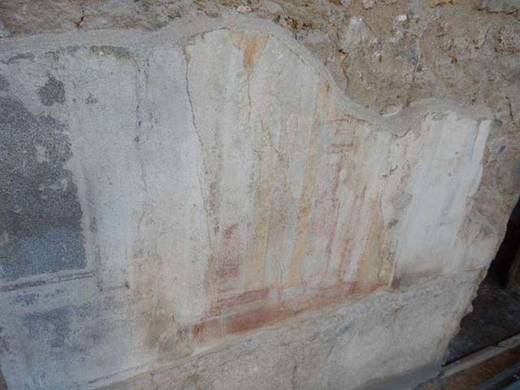 VII.2.45 Pompeii, May 2018. Atrium, painted decoration on west wall between doorways to cubiculum and room with stairs. 
Photo courtesy of Buzz Ferebee.
