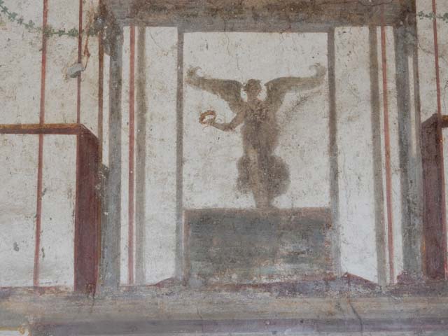 VII.4.48 Pompeii. May 2015. Room 14, flying figure from south end of west wall of cubiculum. Photo courtesy of Buzz Ferebee.
