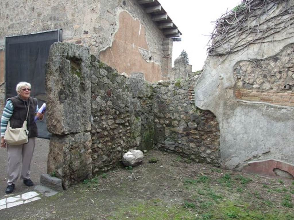 VII.4.48 Pompeii. March 2009. Room 17, west wall with doorway to peristyle, and north-west corner. 


