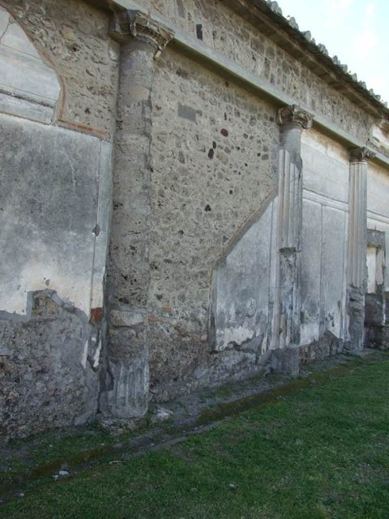 VII.4.57 Pompeii. March 2009. Peristyle, west wall looking north from south end.