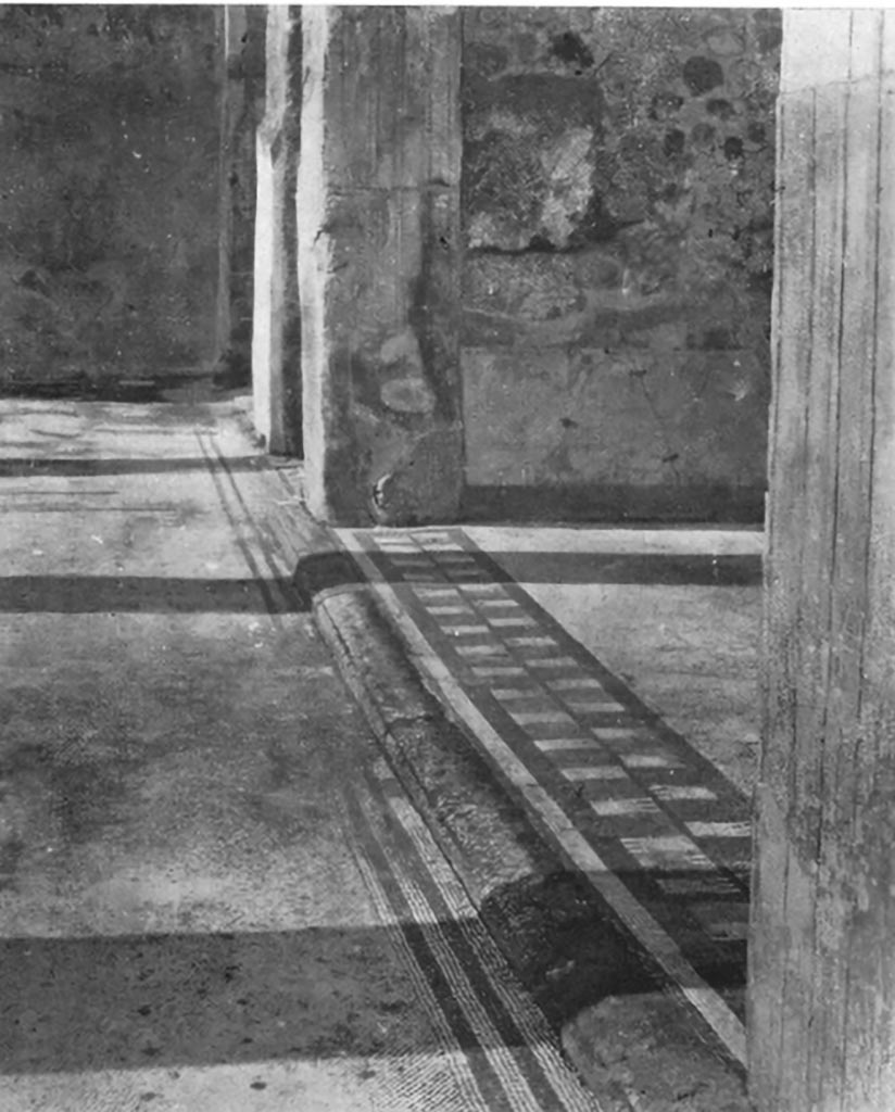 VII.7.5 Pompeii. C.1930. Looking west across flooring of portico, and threshold of exedra (u)/tablinum.   
According to Blake –
The pattern on this flooring was described erroneously, as The Turreted Wall, and used in the threshold of the tablinum (?) of VII.7.5, occurring only once to my knowledge, in a pavement which is probably to be assigned to the first century AD. (p.106)
See Blake, M., (1930). The pavements of the Roman Buildings of the Republic and Early Empire. Rome, MAAR, 8, (p.73 and 106 & pl.2, tav.2).
