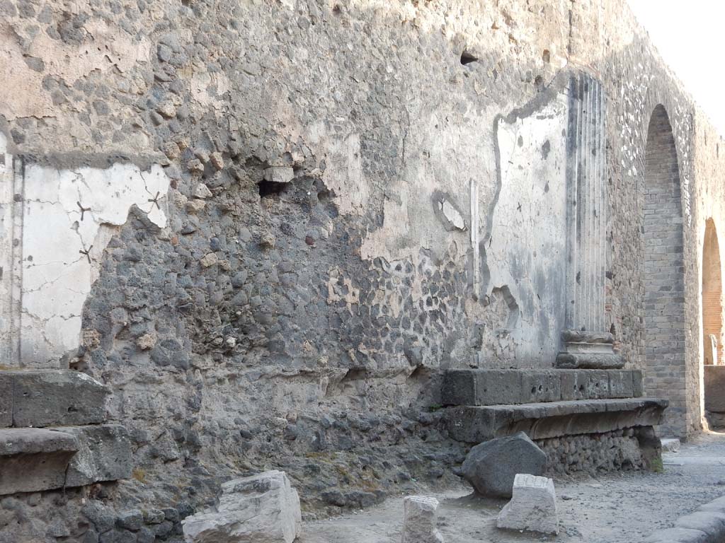 VII.8 Pompeii Forum. June 2019. 
Looking west along north wall of Forum in Vicolo dei Soprastanti, towards arch near VII.8.26 and fountain, on right.
Photo courtesy of Buzz Ferebee.
For a description of excavations carried out on the north side of the Temple, and in the north-west corner of the Forum (west side of Temple),
See Notizie degli Scavi, 1942, (p.309-320).

