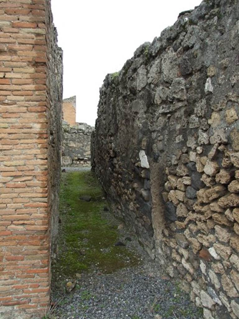 VII.9.47 Pompeii.  March 2009.  Room 13.  Looking north along Corridor from Peristyle to Services area.