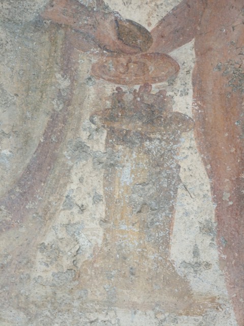 VII.11.14 Pompeii. March 2009. Garden “C”, detail of altar on lararium. 
Jupiter and the Genius both hold a patera in their hand.
