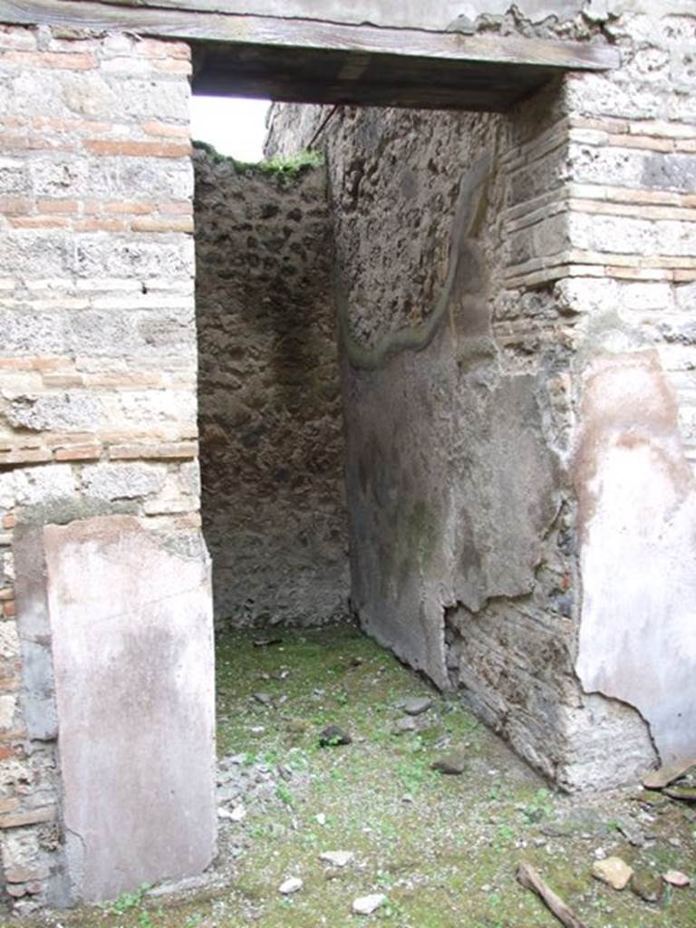 VII.11.14 Pompeii. March 2009. Doorway to room 15, small room or cupboard.