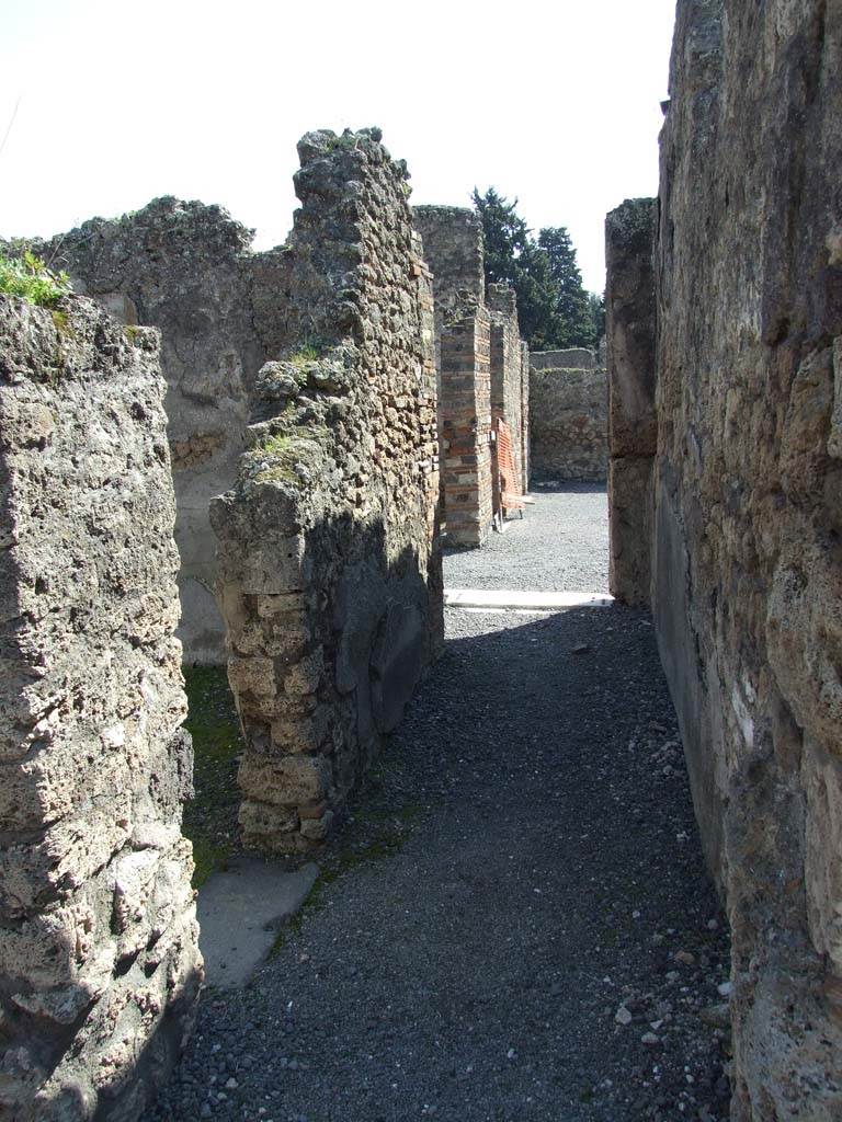 VII.14.9 Pompeii. March 2009. 
Room 11, looking south along corridor to atrium, with doorway in east wall to room 12.
