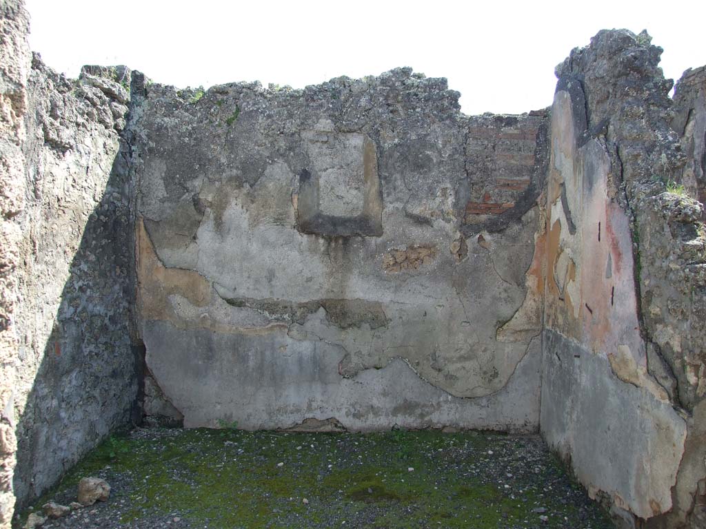 VII.14.9 December 2005.  Room 10. South wall, with door to Room 9, and filled in niche, on left .