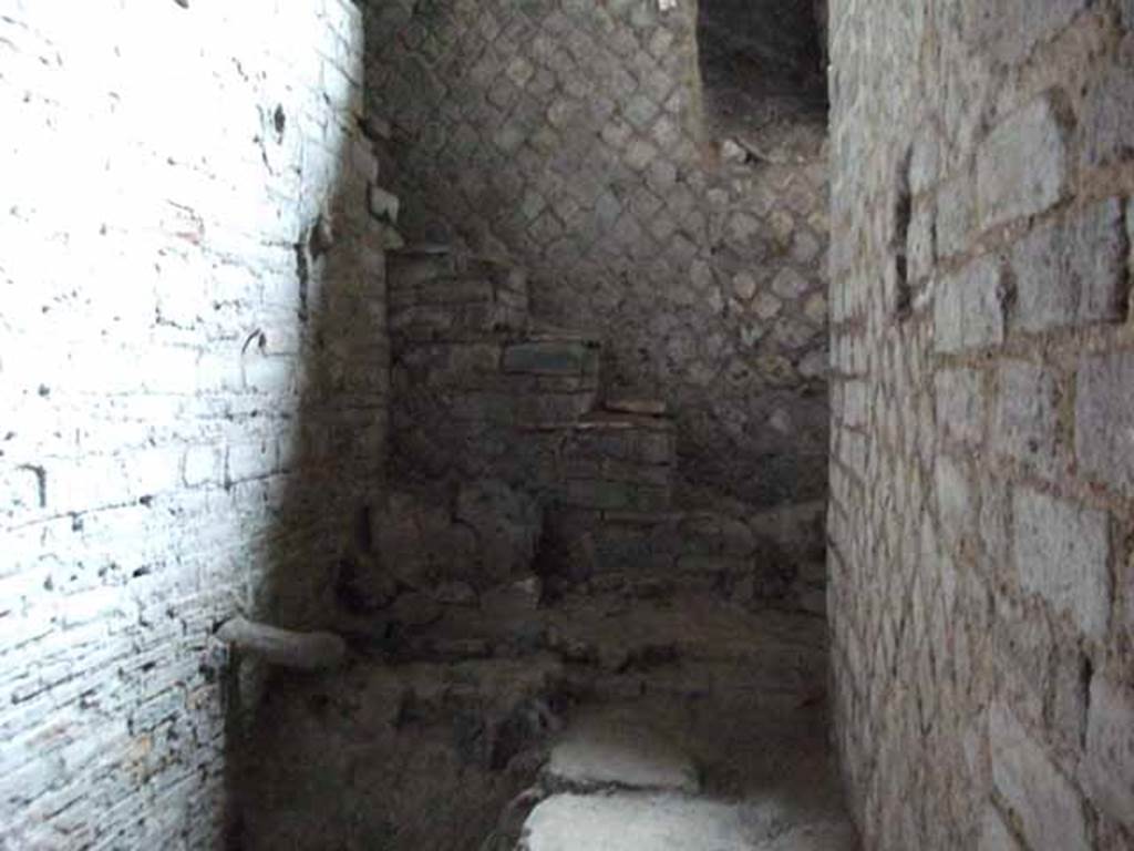 VII.16.a Pompeii. May 2010. Room 11, looking to north end of corridor with small steps to top of furnace.
