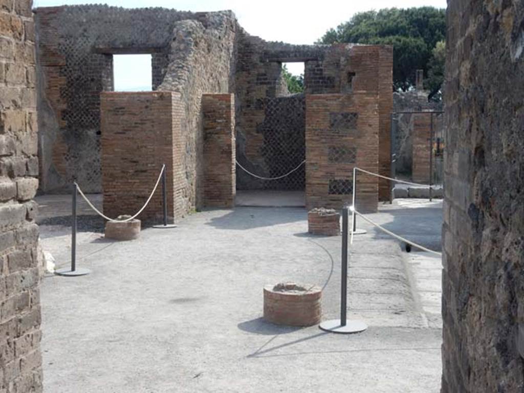 VIII.2.14 Pompeii. May 2017. Looking east across north side of atrium, from east end of corridor leading to and from peristyle area. Photo courtesy of Buzz Ferebee.
