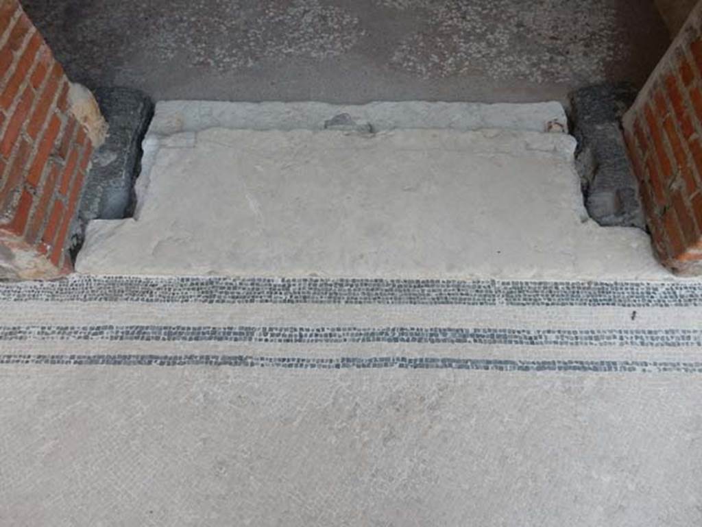 VIII.2.16 Pompeii. May 2017.  Threshold of doorway to cubiculum in south-east corner of atrium, a single slab of limestone. Photo courtesy of Buzz Ferebee.
