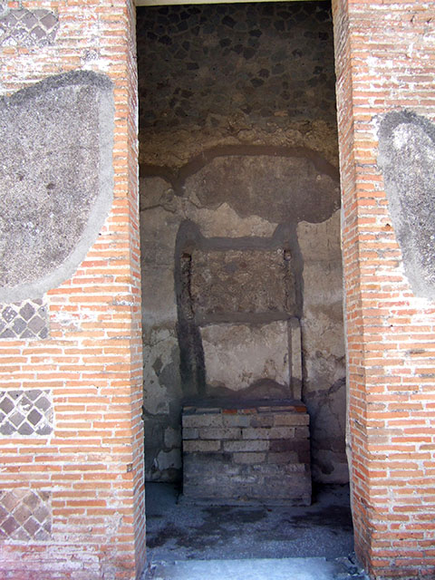 VIII.2.16 Pompeii. September 2005. Doorway to room on south side of atrium, with household shrine. 
