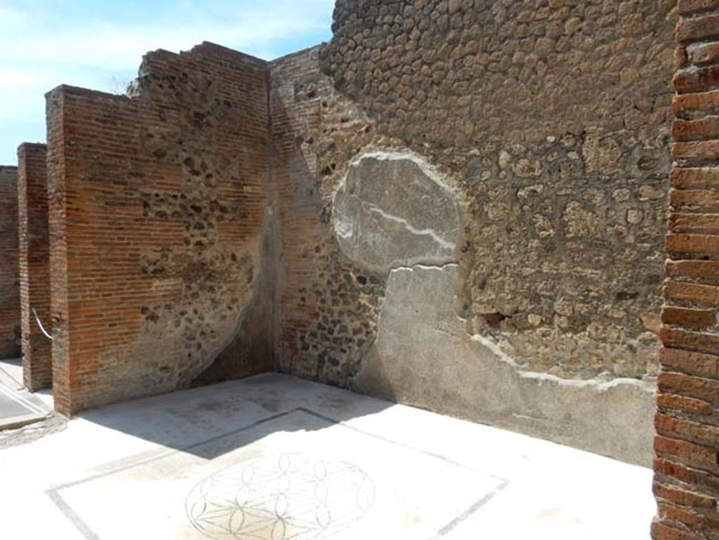 VIII.2.16 Pompeii. May 2017. Triclinium in north-west corner of atrium with doorway onto north portico, on left. The floor was travertine, inserted in the centre was a mosaic with a black border showing a circle containing 6-petalled stars.  Photo courtesy of Buzz Ferebee.
