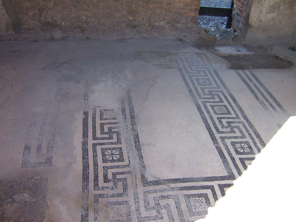 VIII.2.16 Pompeii. September 2005. 
Cubiculum on north side of atrium with mosaic floor and a windowed niche, looking into atrium of VIII.2.14. 
