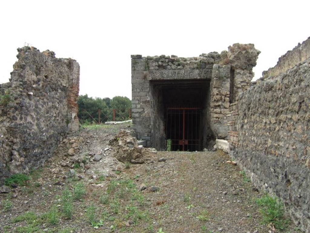 VIII.2.36 Pompeii. May 2006. On the left are the remains of steps to the peristyle of VIII.2.37.   On the right is the passage to the lower levels.
